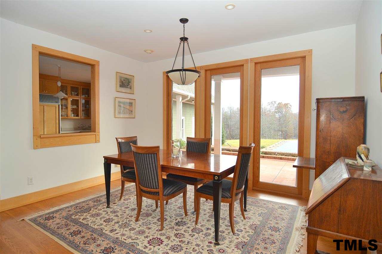 7411 Bill Poole Road Rougemont, NC 27572 - Photo 9 of 25 Lovely Sun Filled Dining Room w/ Attractive Door Trim & Wide Baseboards. Nice Pass Through to Kitchen.