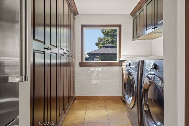 a bedroom with bed and a potted plant