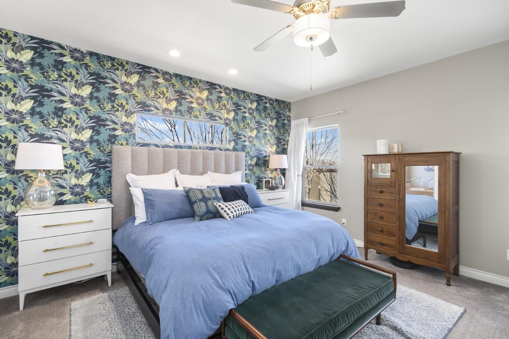 744 Ruby Ranch Drive Grand Junction, CO 81505 - Photo 12 of 33 a bedroom with a bed a rug and wall painting