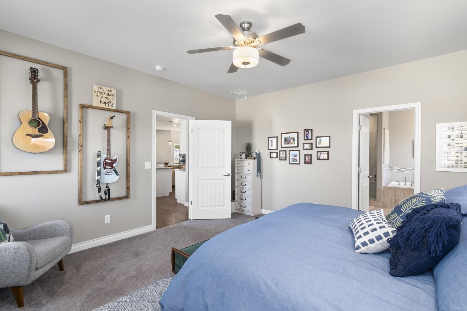 744 Ruby Ranch Drive Grand Junction, CO 81505 - Photo 13 of 33 a bedroom with a bed and a couch