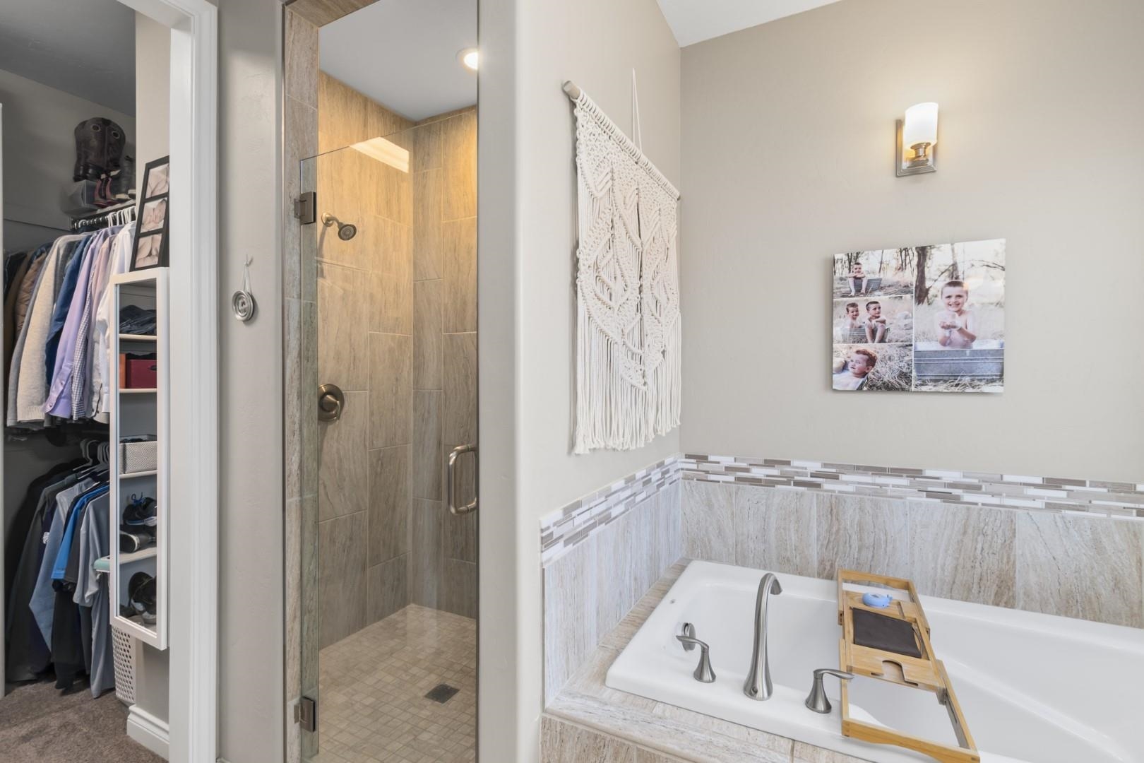 744 Ruby Ranch Drive Grand Junction, CO 81505 - Photo 16 of 33 a bathroom with a tub a sink and a shower