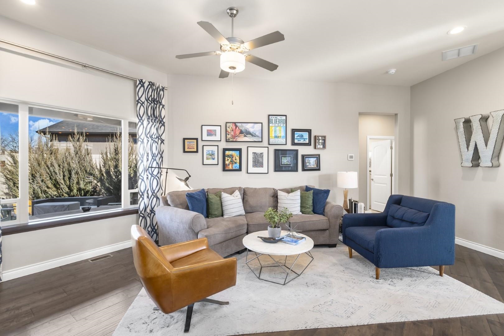 744 Ruby Ranch Drive Grand Junction, CO 81505 - Photo 2 of 33 a living room with furniture and a large window
