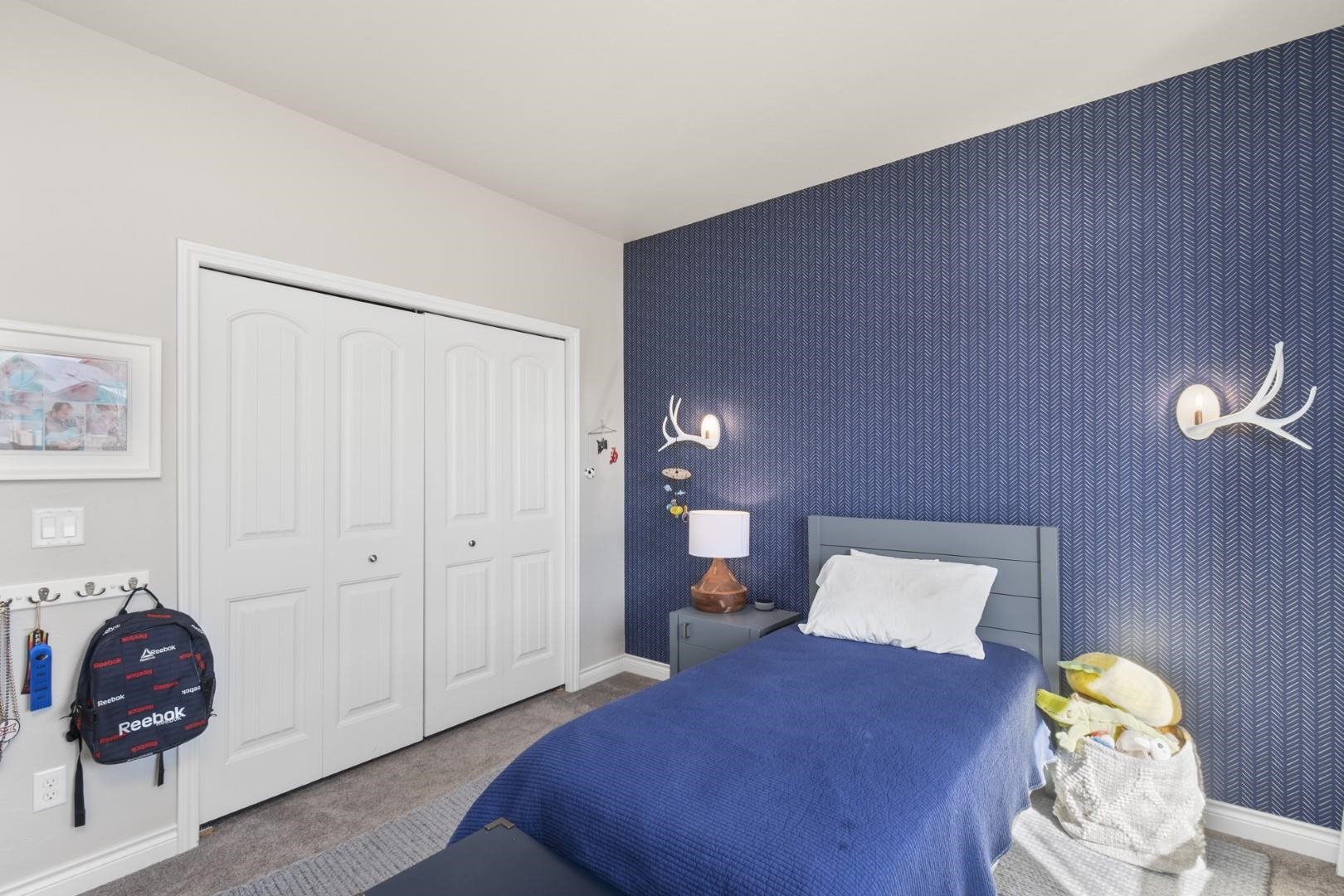 744 Ruby Ranch Drive Grand Junction, CO 81505 - Photo 21 of 33 a living room with furniture and lamp