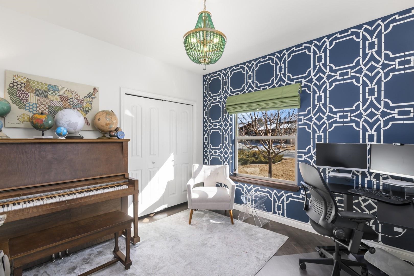 744 Ruby Ranch Drive Grand Junction, CO 81505 - Photo 23 of 33 a living room with furniture and wooden floor