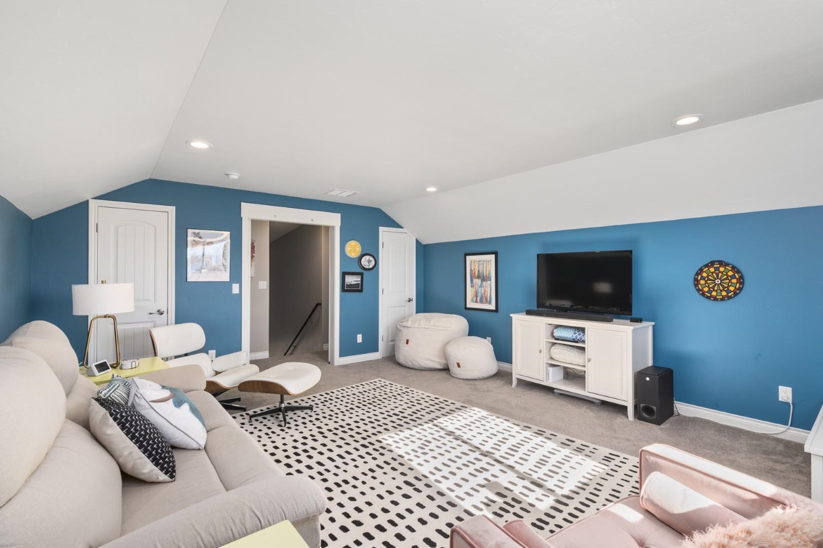 744 Ruby Ranch Drive Grand Junction, CO 81505 - Photo 26 of 33 a bedroom with furniture and a flat screen tv