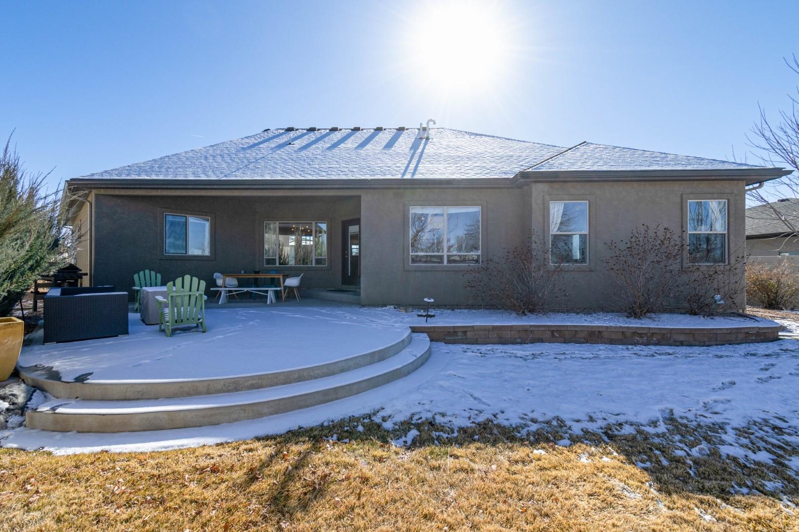 744 Ruby Ranch Drive Grand Junction, CO 81505 - Photo 27 of 33 a view of a house with a patio