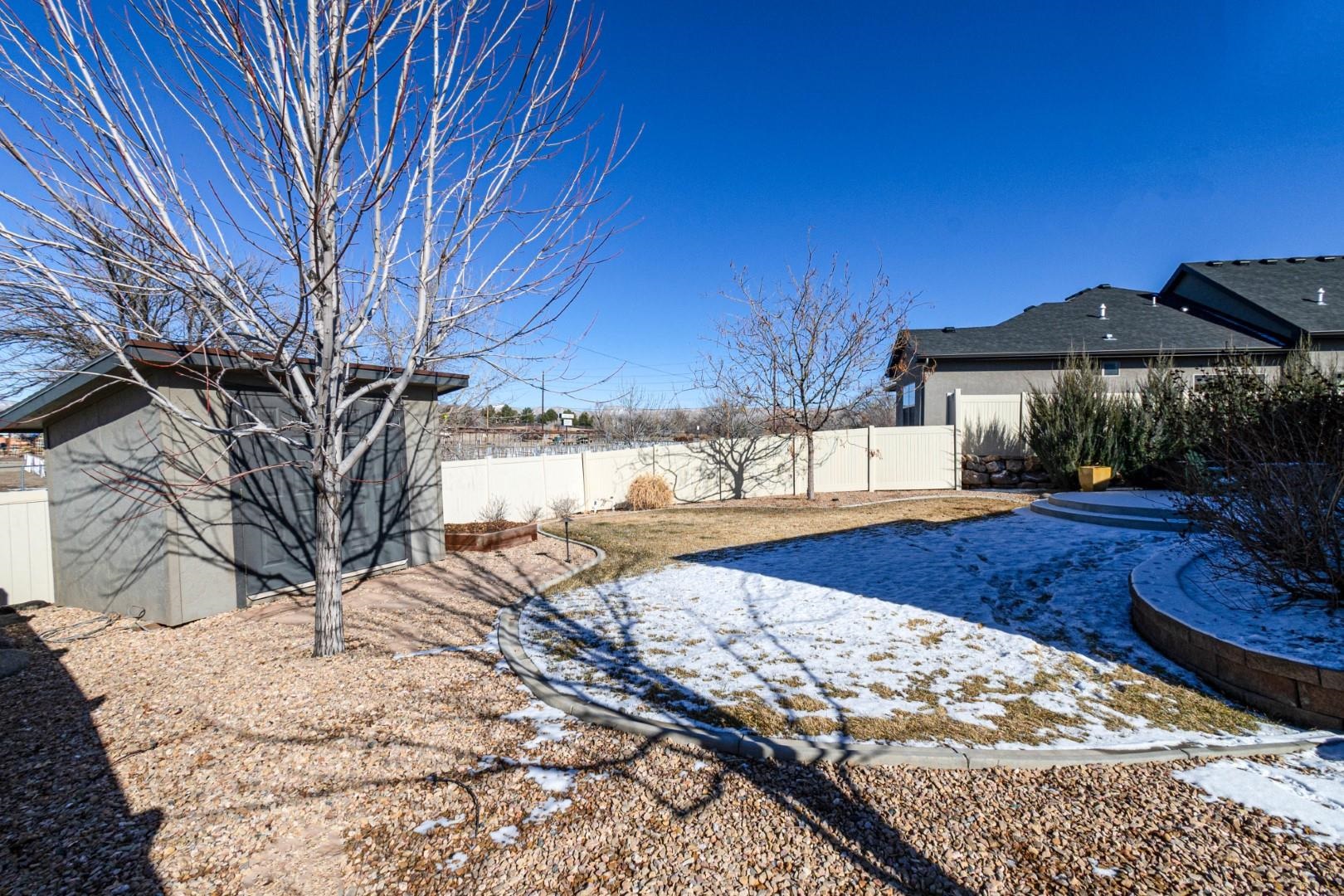 744 Ruby Ranch Drive Grand Junction, CO 81505 - Photo 30 of 33 a view of a house with yard and covered with snow