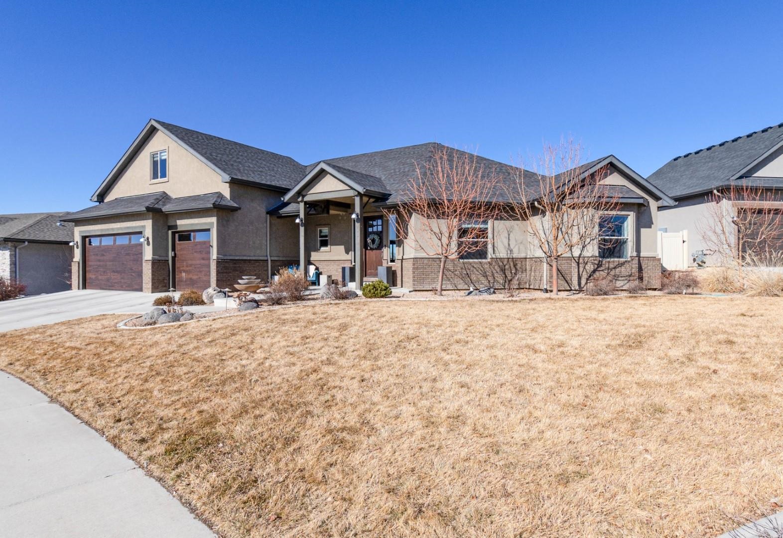 744 Ruby Ranch Drive Grand Junction, CO 81505 - Photo 31 of 33 a view of a white house with a large pool