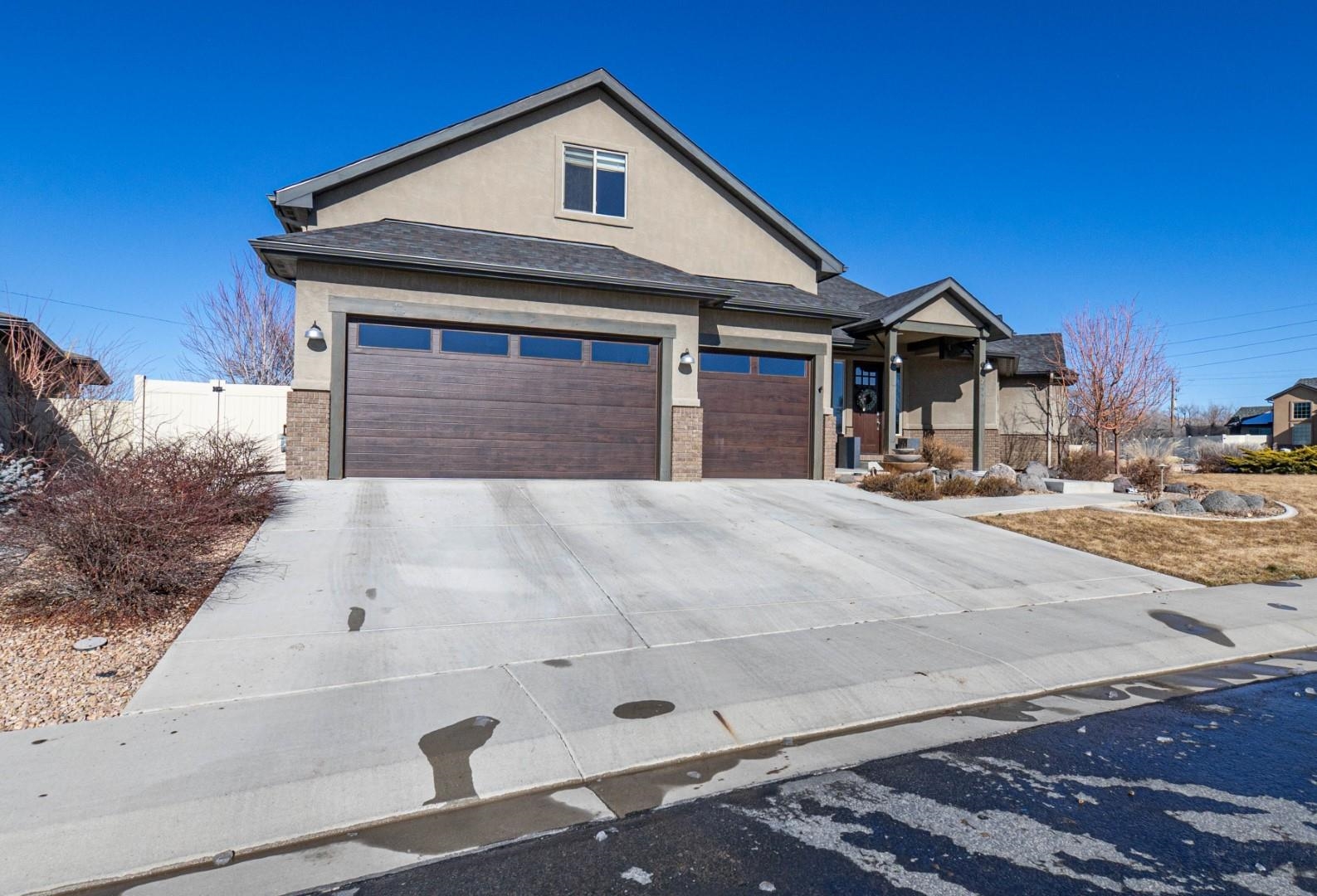 744 Ruby Ranch Drive Grand Junction, CO 81505 - Photo 32 of 33 a front view of a house with a yard