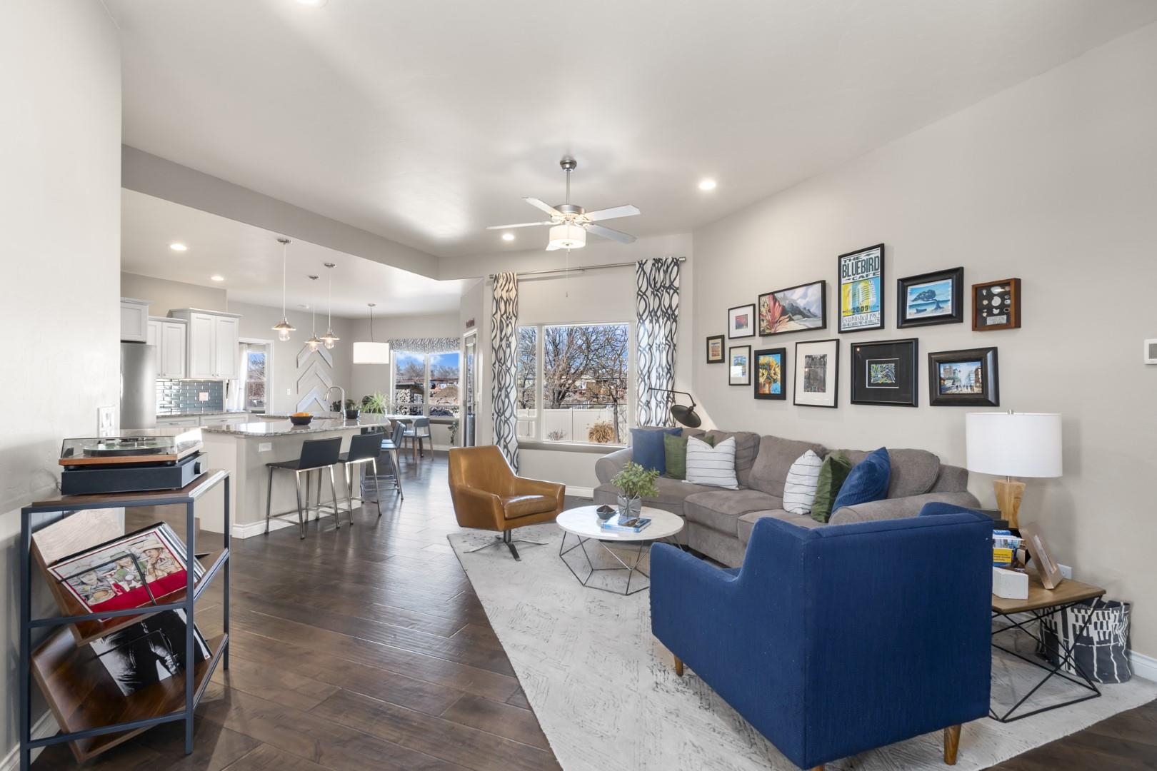 744 Ruby Ranch Drive Grand Junction, CO 81505 - Photo 4 of 33 a living room with fireplace furniture and a wooden floor