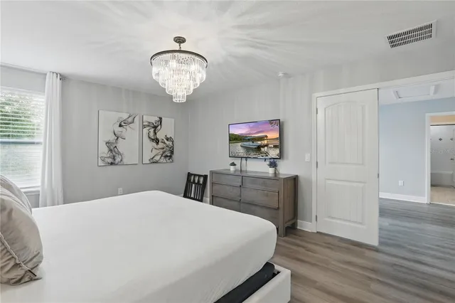 a bedroom with a bed and a dresser