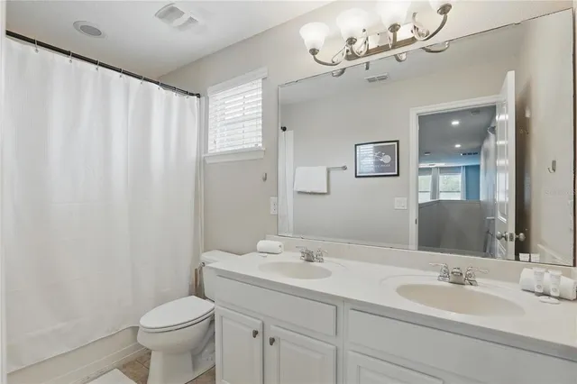 a bedroom with a bed and a night stand