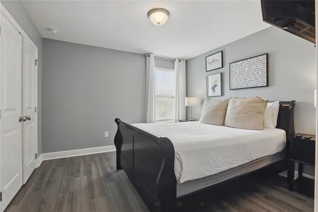 a view of a patio with a table and chairs under an umbrella
