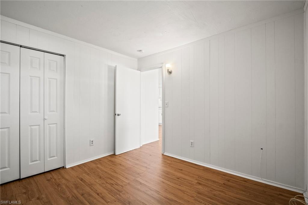3215 Jeffcott Street Fort Myers, FL 33916 - Photo 31 of 33 Unfurnished bedroom with wood finished floors and a closet