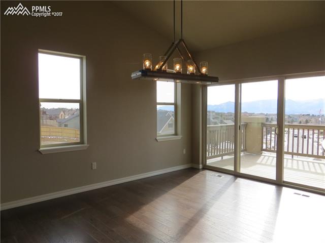 10604 Slumber Ridge Way Colorado Springs, CO 80908 - Photo 6 of 36 Dining Area with Walk Out to Deck Yielding Spectacular Views!