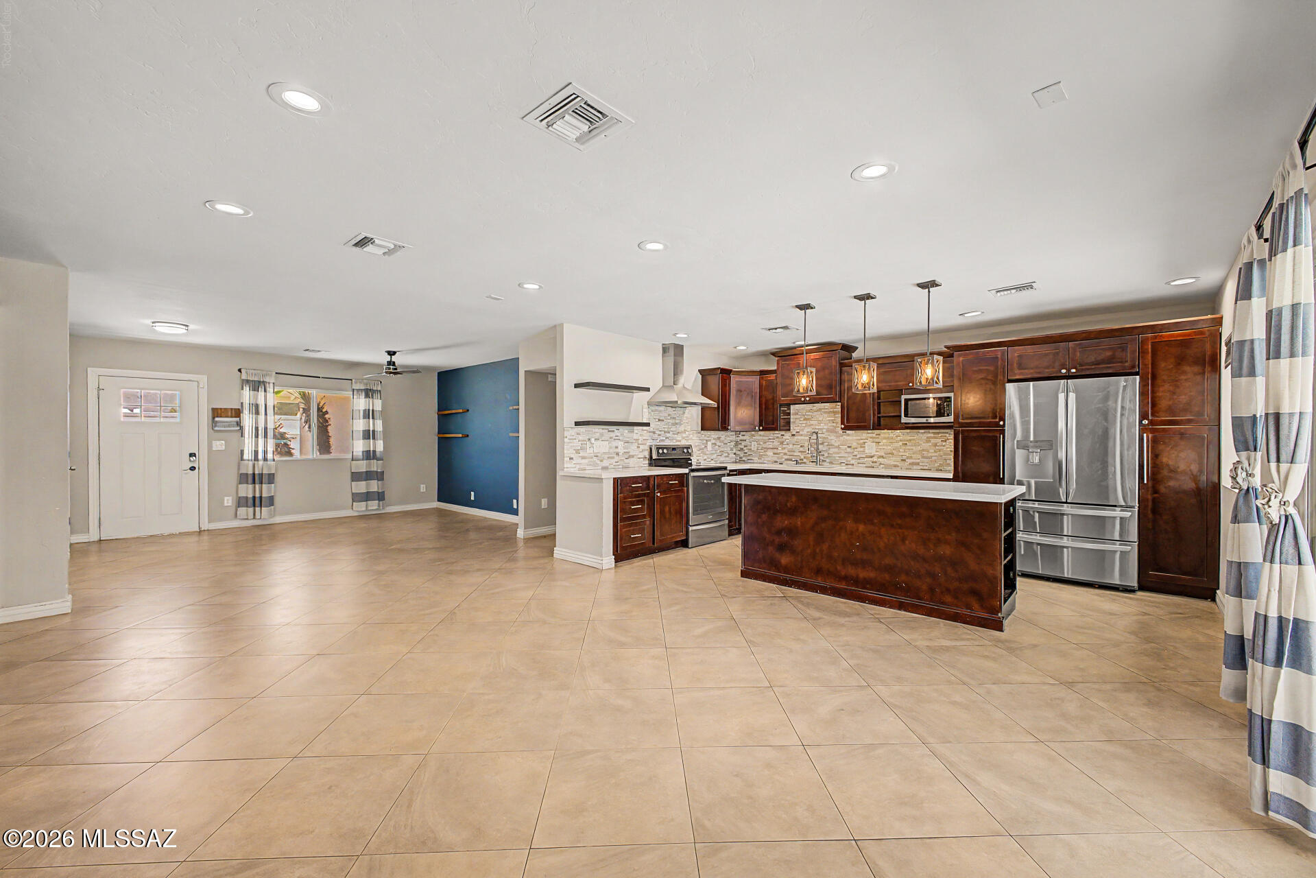 7550 East Rio Verde Drive Tucson, AZ 85715 - Photo 10 of 25 The kitchen, dining, and living areas come together effortlessly for everyday living & entertaining.