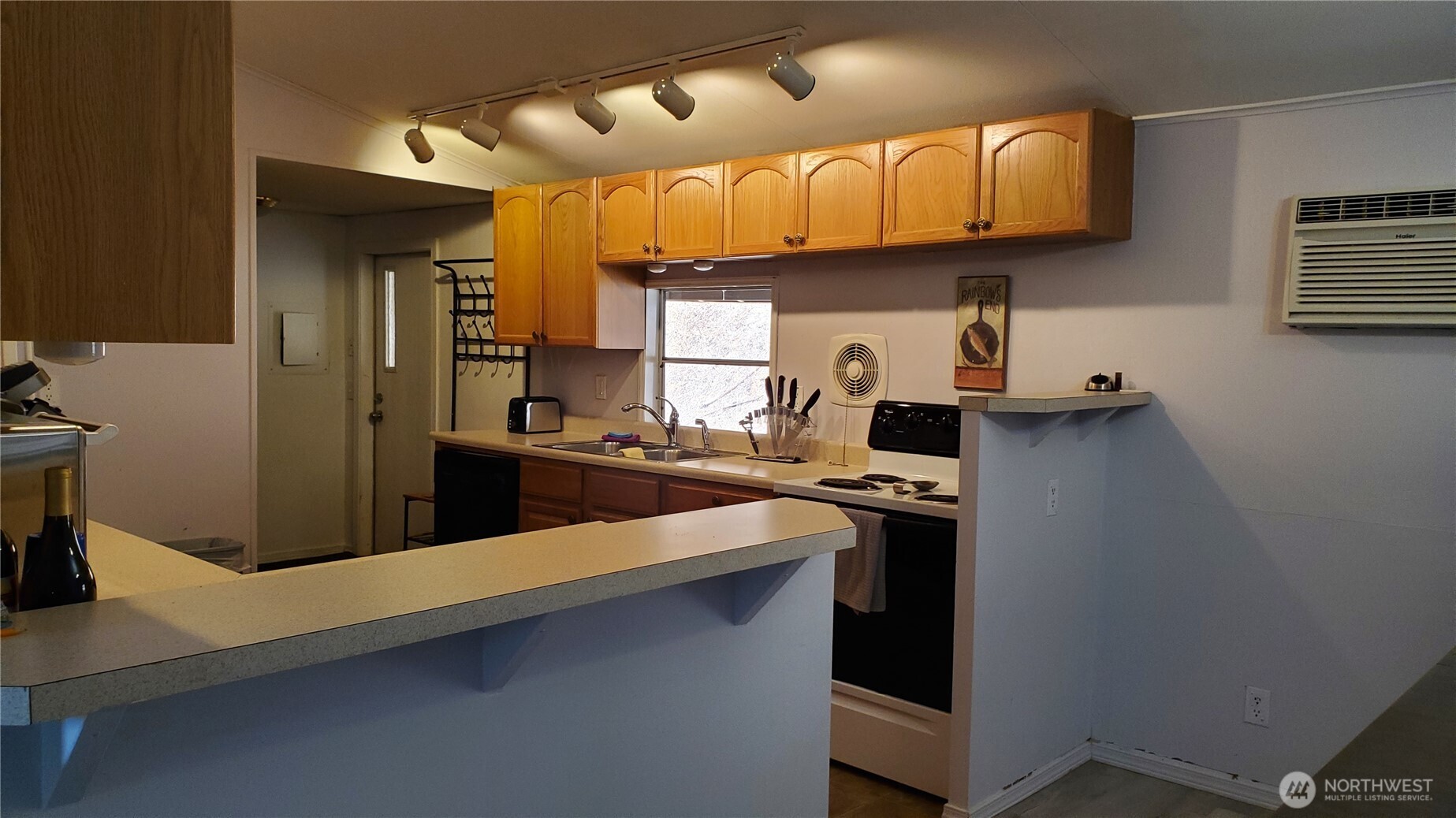 25619 Camp 12 Road Leavenworth, WA 98826 - Photo 11 of 29 a kitchen with stainless steel appliances a sink a stove and a refrigerator