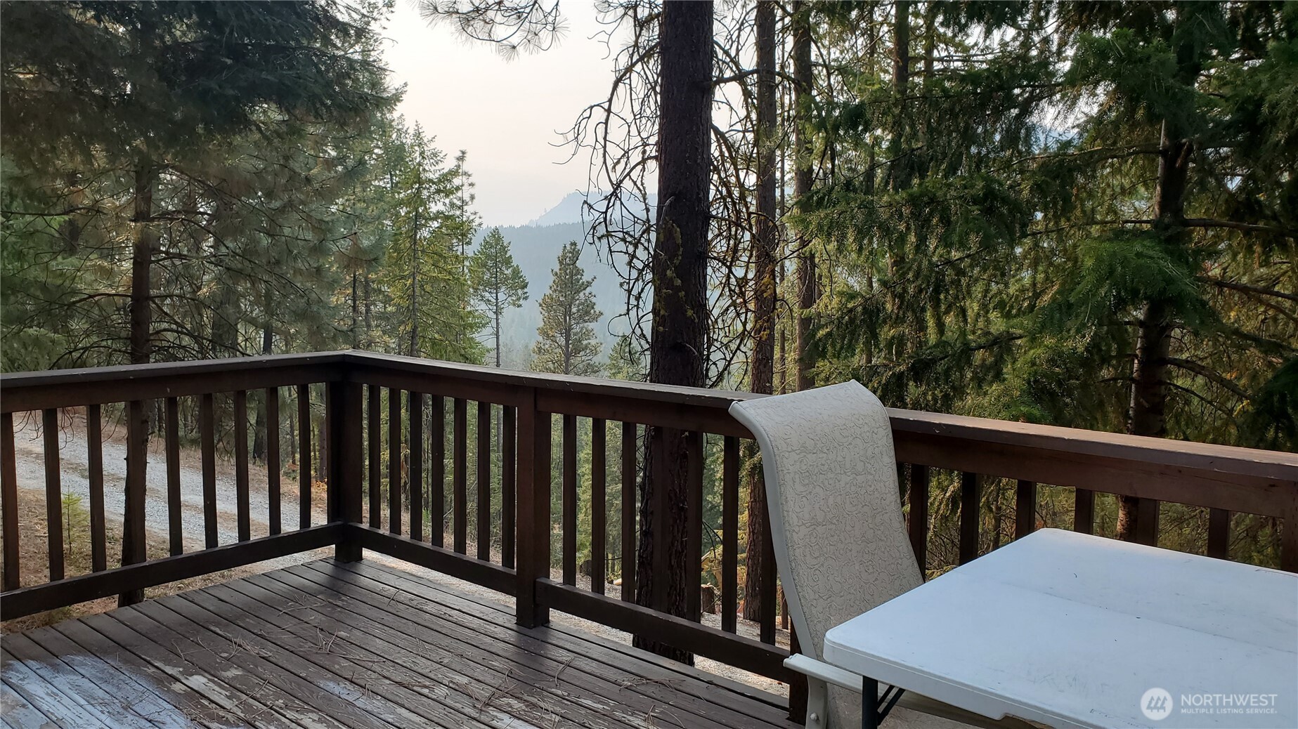 25619 Camp 12 Road Leavenworth, WA 98826 - Photo 13 of 29 a balcony with wooden floor and outdoor space