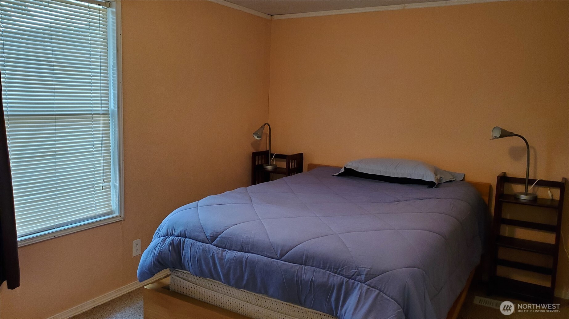 25619 Camp 12 Road Leavenworth, WA 98826 - Photo 20 of 29 a bedroom with a bed and a window