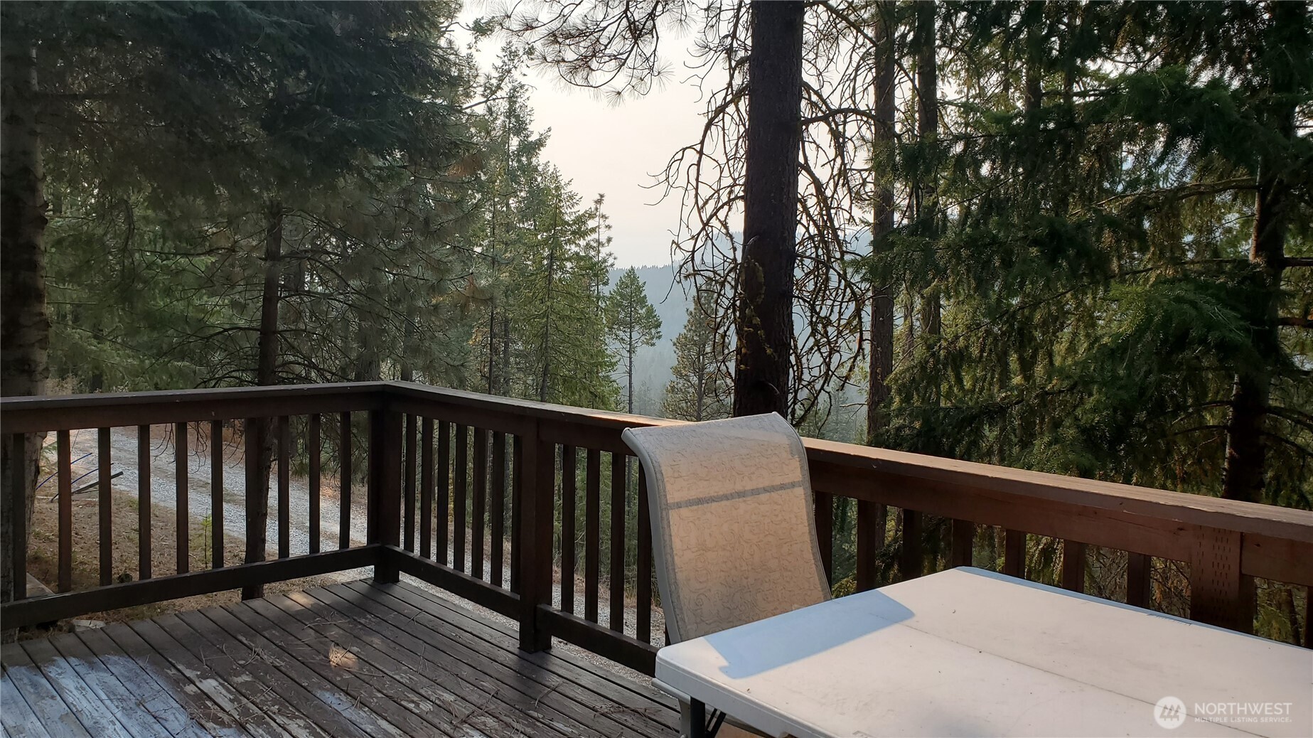 25619 Camp 12 Road Leavenworth, WA 98826 - Photo 27 of 29 a balcony with wooden floor and yard in the back