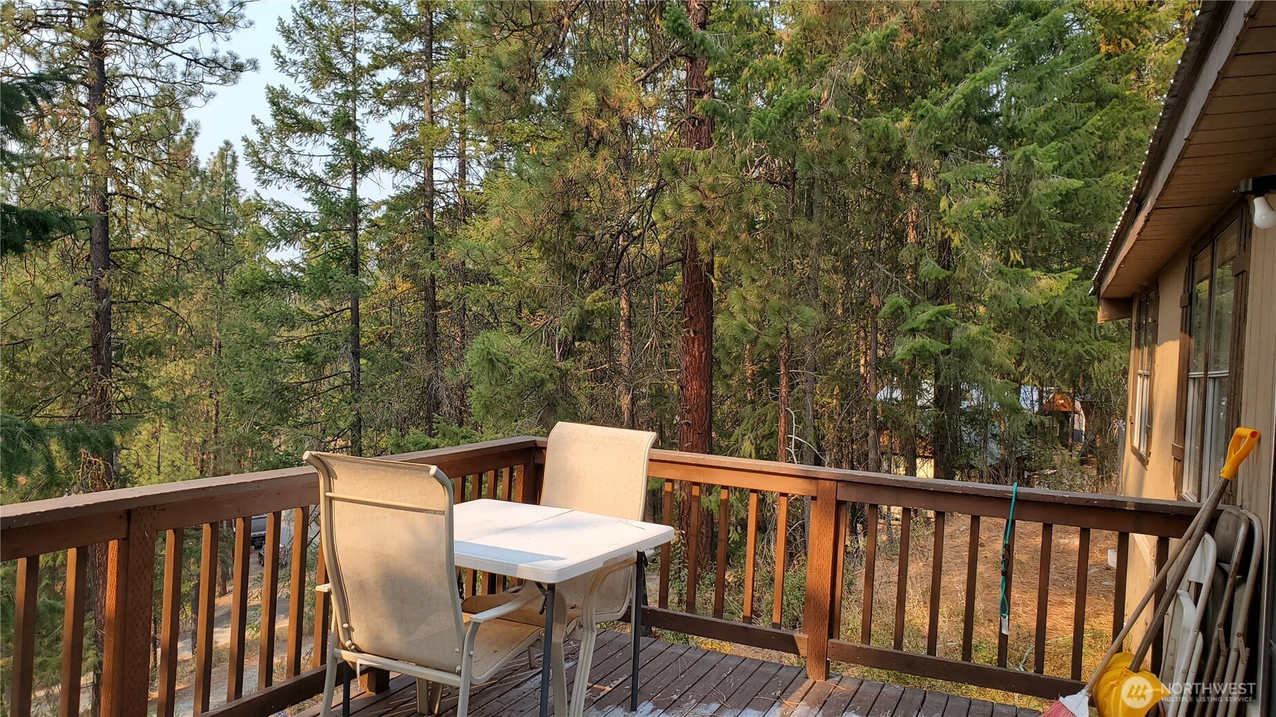 25619 Camp 12 Road Leavenworth, WA 98826 - Photo 5 of 29 a view of a chair and table on the roof deck