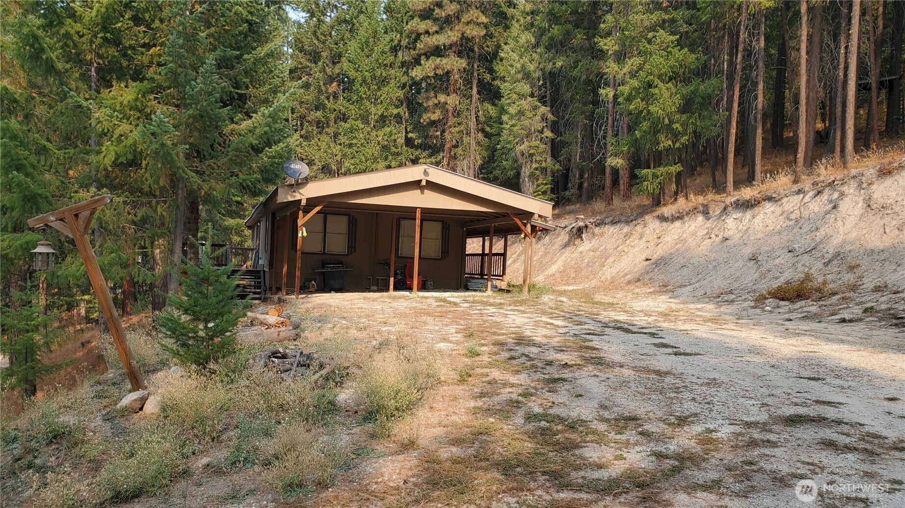 25619 Camp 12 Road Leavenworth, WA 98826 - Photo 10 of 29 a view of a house with a yard and tree