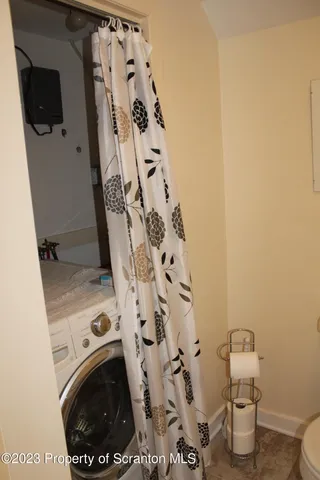 view of bathroom with a sink and washing machine