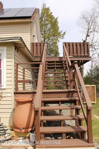 a front view of a house with large windows