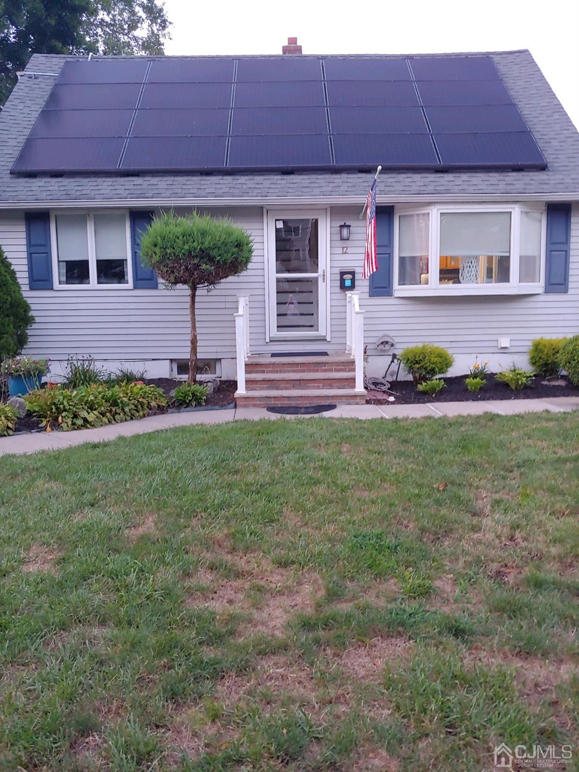 12 Bowser Road New Brunswick, NJ 08901 - Photo 1 of 21 a front view of a house with garden