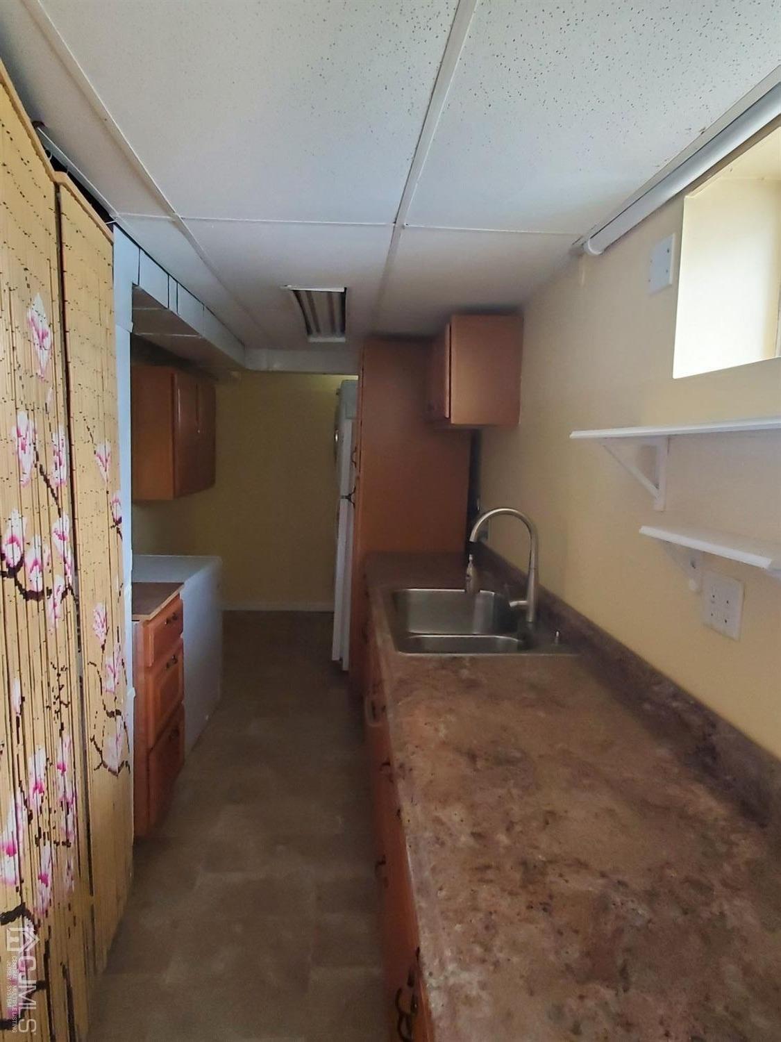 12 Bowser Road New Brunswick, NJ 08901 - Photo 14 of 21 a kitchen with refrigerator and window