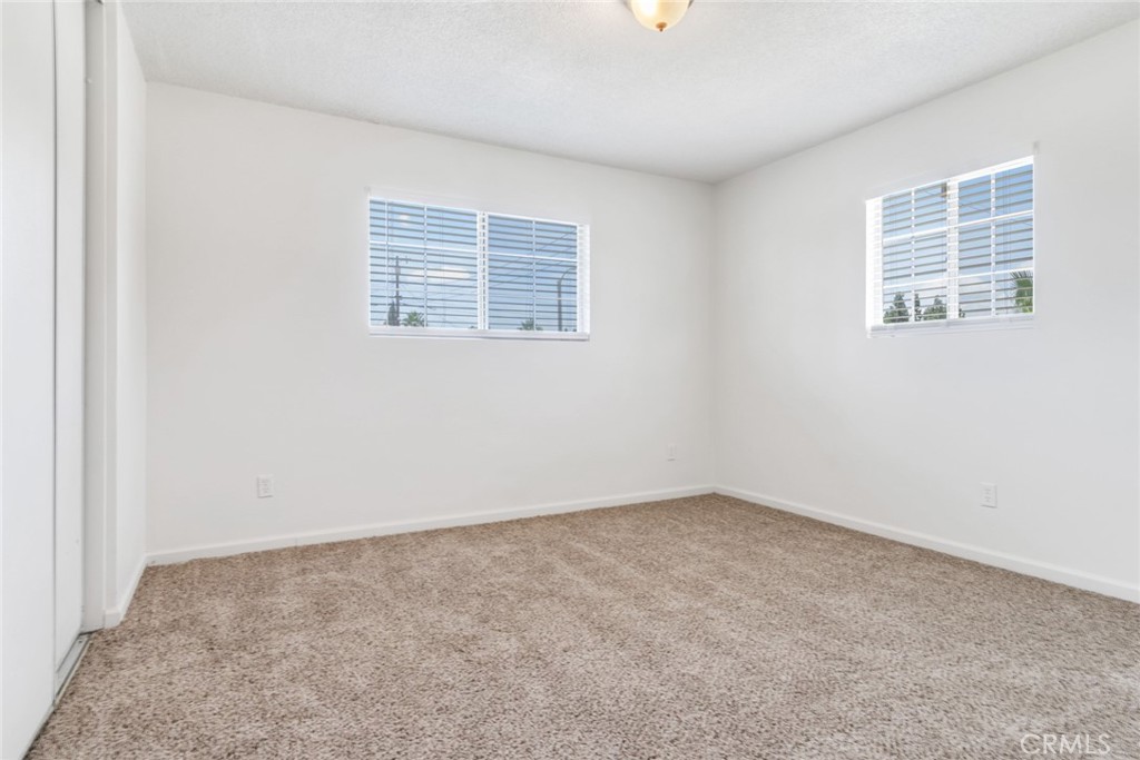 8955 Holly Lane Riverside, CA 92503 - Photo 14 of 32 an empty room with windows