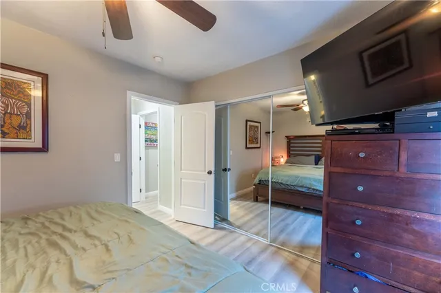 a bed room with a bed and a television