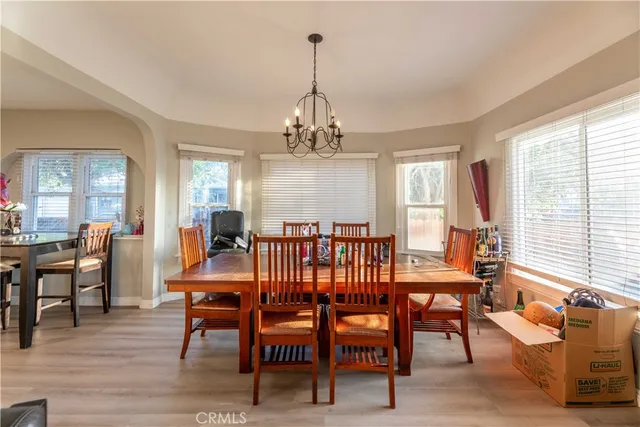 a view of a dining room with furniture window and outside view