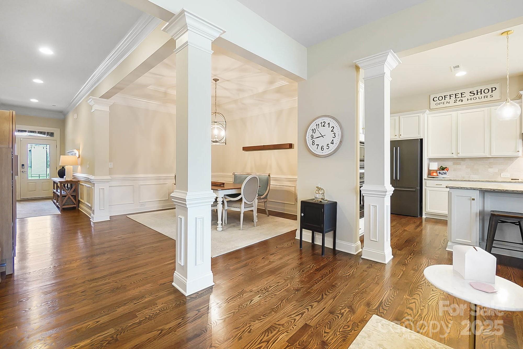 1419 Vickery Drive Matthews, NC 28104 - Photo 14 of 48 a livingroom with furniture wooden floor and a clock