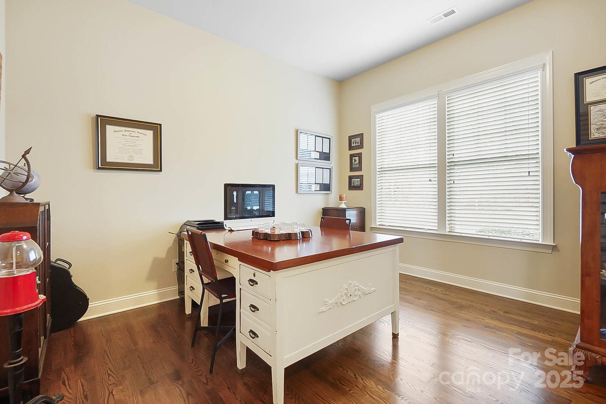 1419 Vickery Drive Matthews, NC 28104 - Photo 18 of 48 a view of a workspace with furniture and a window