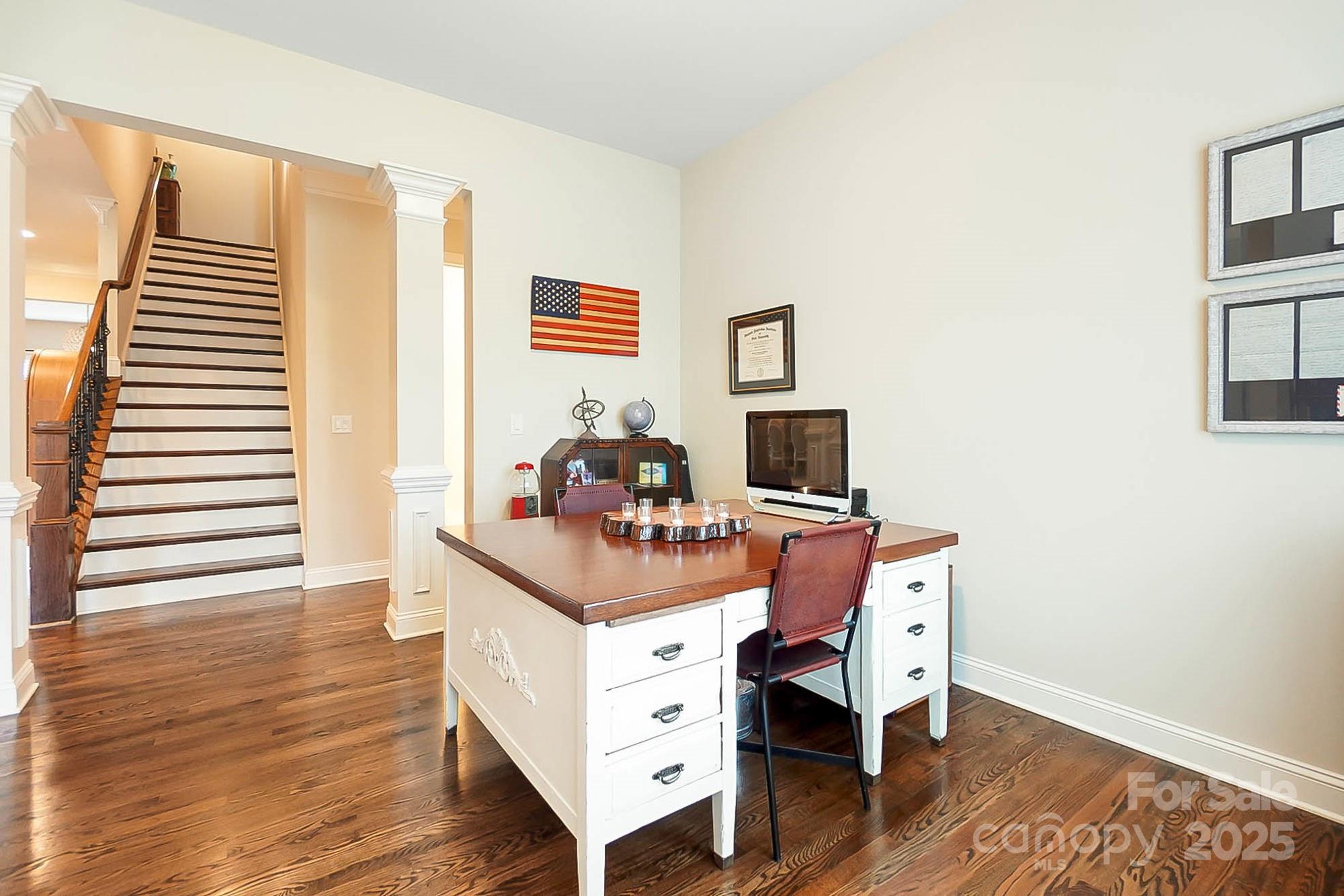 1419 Vickery Drive Matthews, NC 28104 - Photo 19 of 48 a view of a workspace with furniture and wooden floor