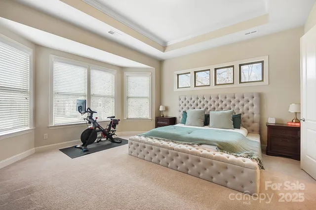 a bedroom with a bed and a couch