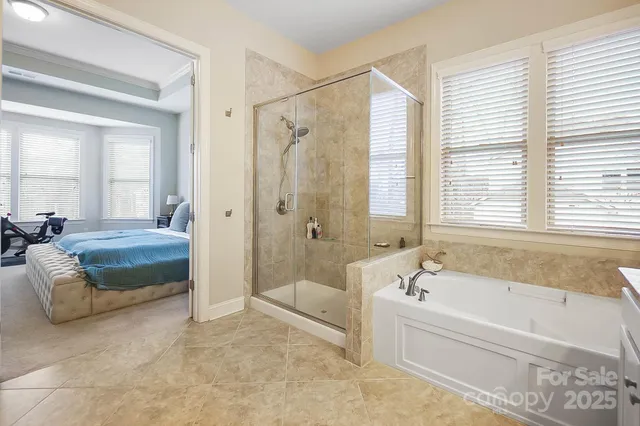 a spacious bathroom with sink shower and bathtub