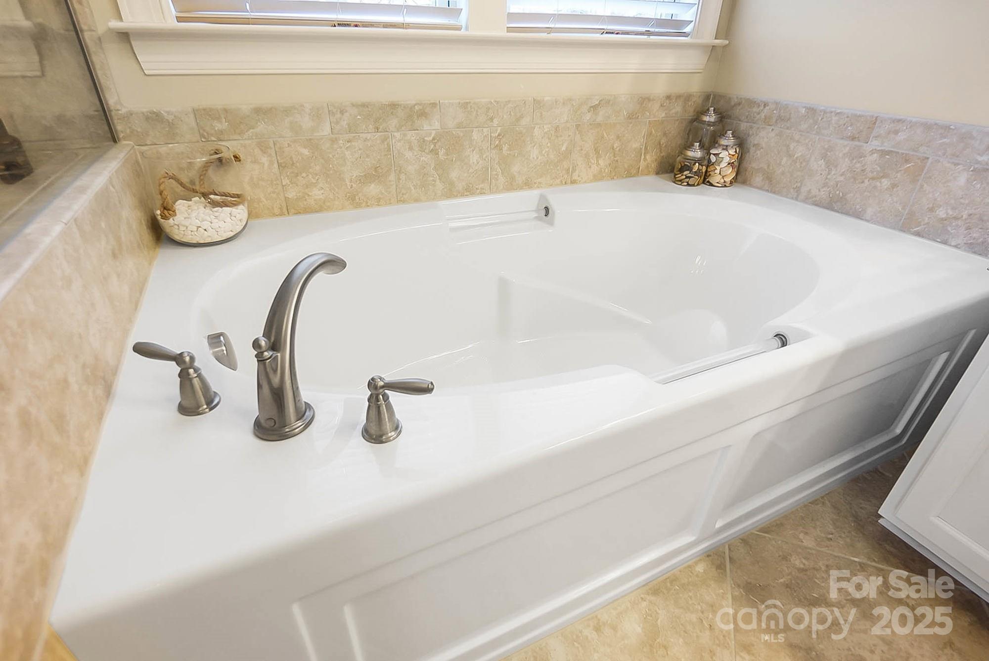 1419 Vickery Drive Matthews, NC 28104 - Photo 26 of 48 a bathroom with a tub