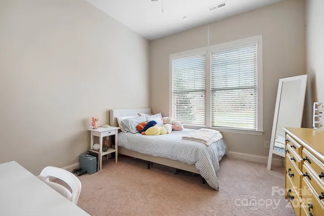 a bed room with a bed and a tv