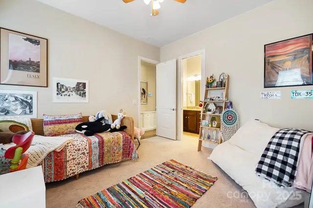 a bedroom with a bed and a lamp