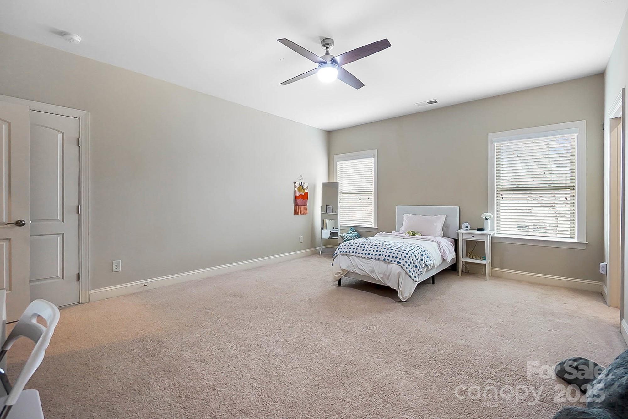 1419 Vickery Drive Matthews, NC 28104 - Photo 34 of 48 a living room with furniture and a large window