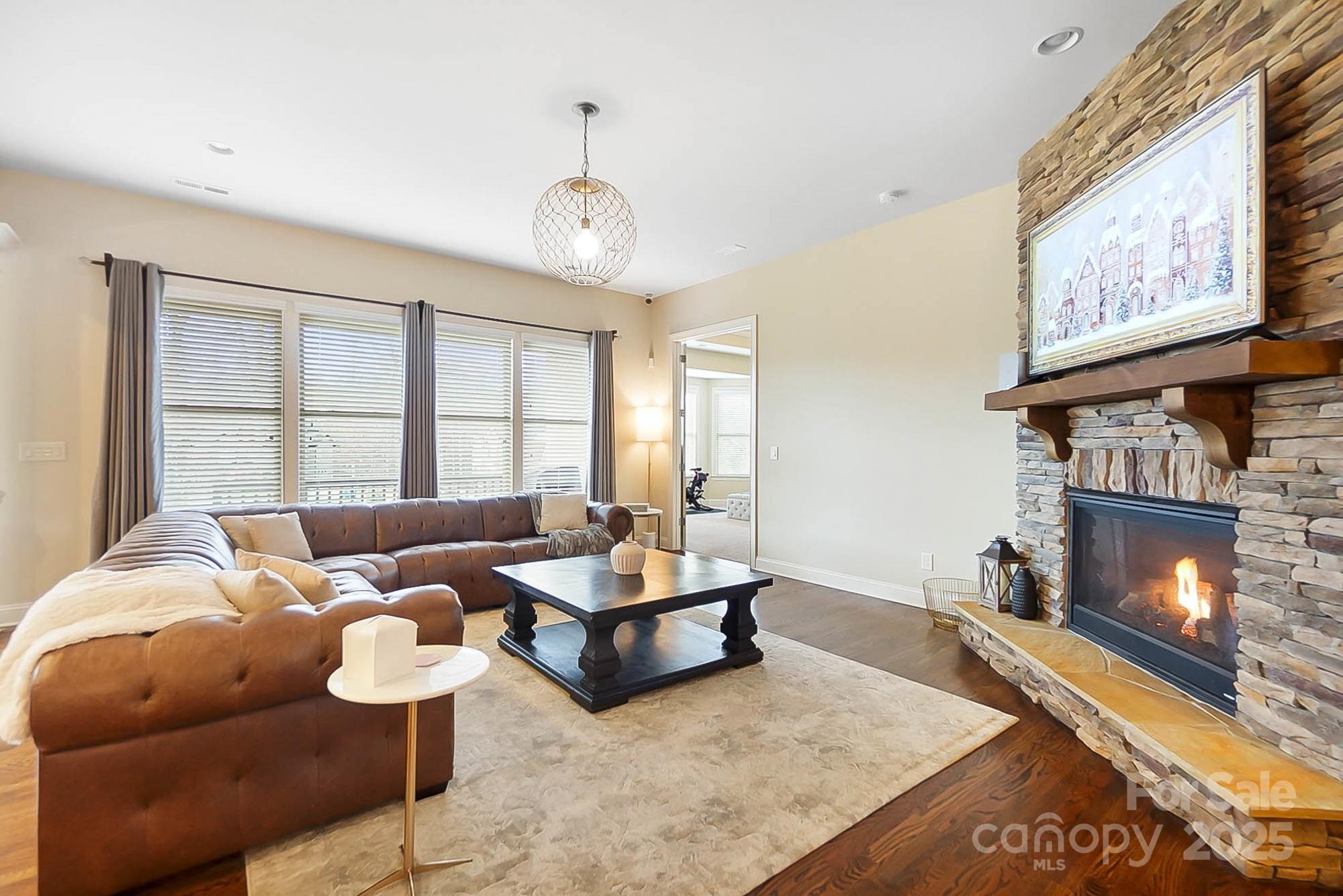 1419 Vickery Drive Matthews, NC 28104 - Photo 4 of 48 a living room with furniture and a fireplace