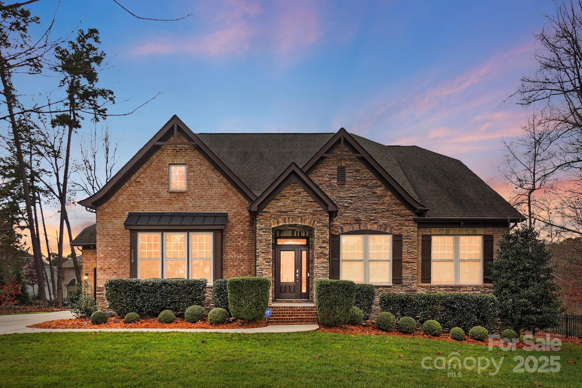 1419 Vickery Drive Matthews, NC 28104 - Photo 46 of 48 a front view of a house with a yard
