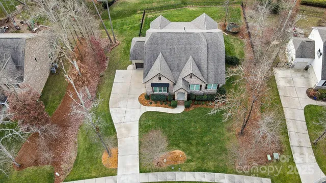 an aerial view of a house with outdoor space