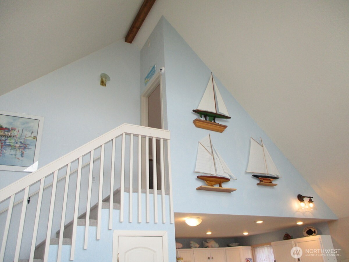 369 North Razor Clam Drive Southwest Ocean Shores, WA 98569 - Photo 12 of 27 a view of staircase and living room with a bathroom
