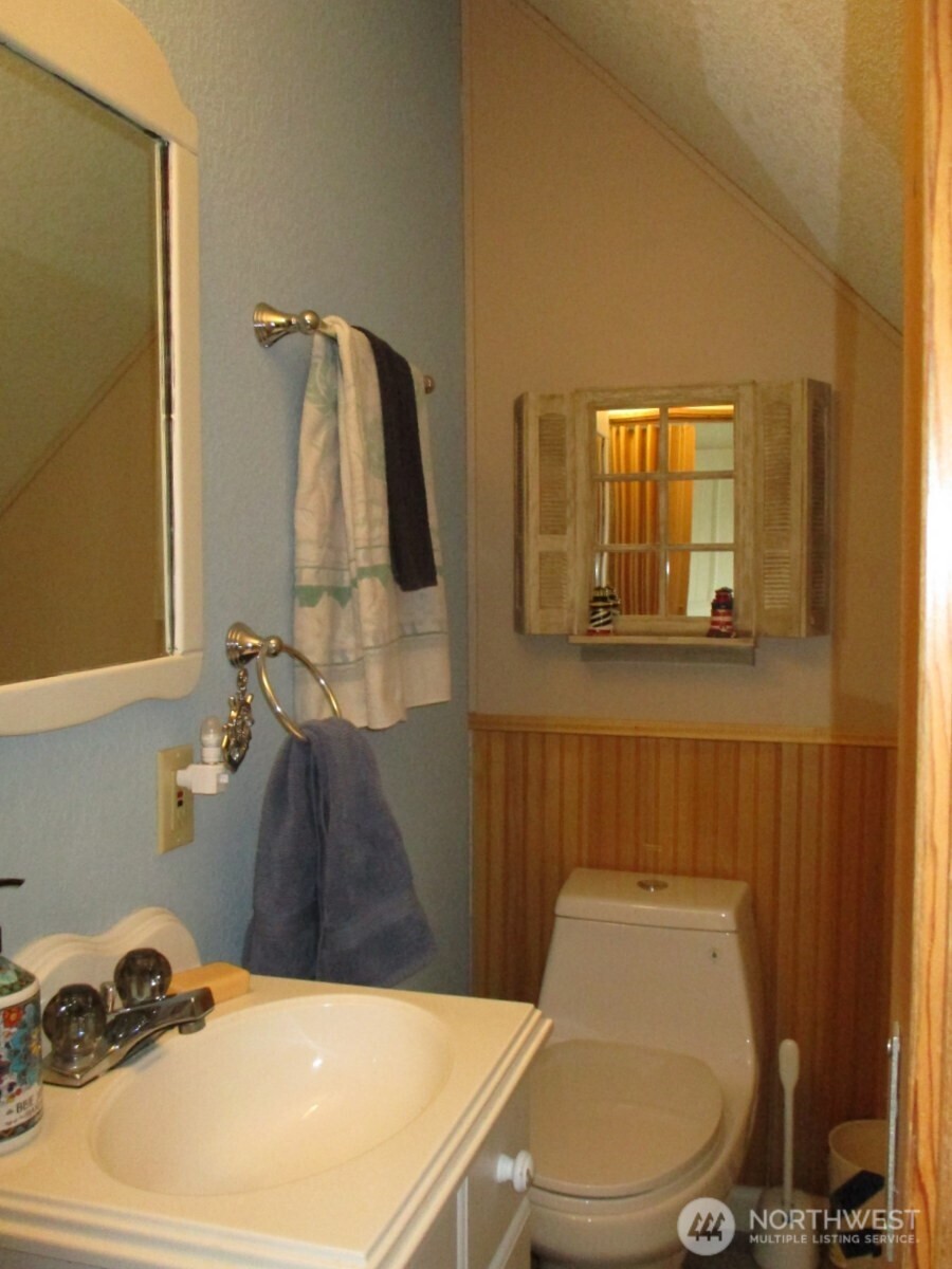 369 North Razor Clam Drive Southwest Ocean Shores, WA 98569 - Photo 15 of 27 a bathroom with a sink and a toilet