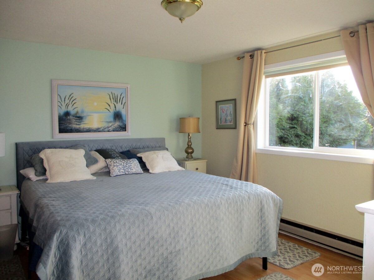 369 North Razor Clam Drive Southwest Ocean Shores, WA 98569 - Photo 16 of 27 a bedroom with a bed and a window