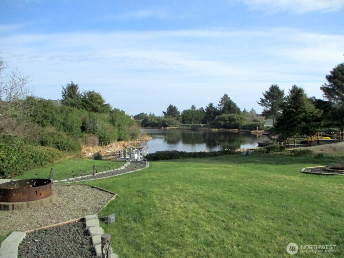 369 North Razor Clam Drive Southwest Ocean Shores, WA 98569 - Photo 2 of 27 a view of a garden with an outdoor seating