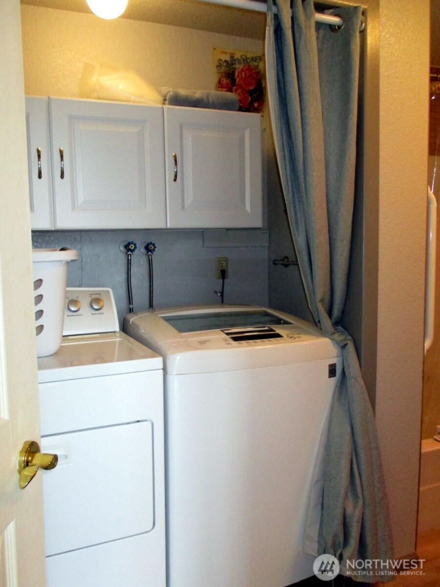 369 North Razor Clam Drive Southwest Ocean Shores, WA 98569 - Photo 21 of 27 a utility room with dryer and washer
